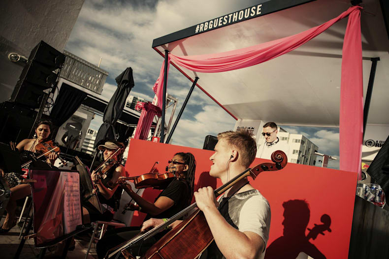 The Best Photos From Red Bull Guest House In Miami From installing a custom neon marquee to branded floats on the water, and even repelling off of the roof to wrap the penthouse in. red bull