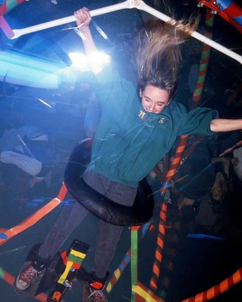 Woman spins in a gyroscope