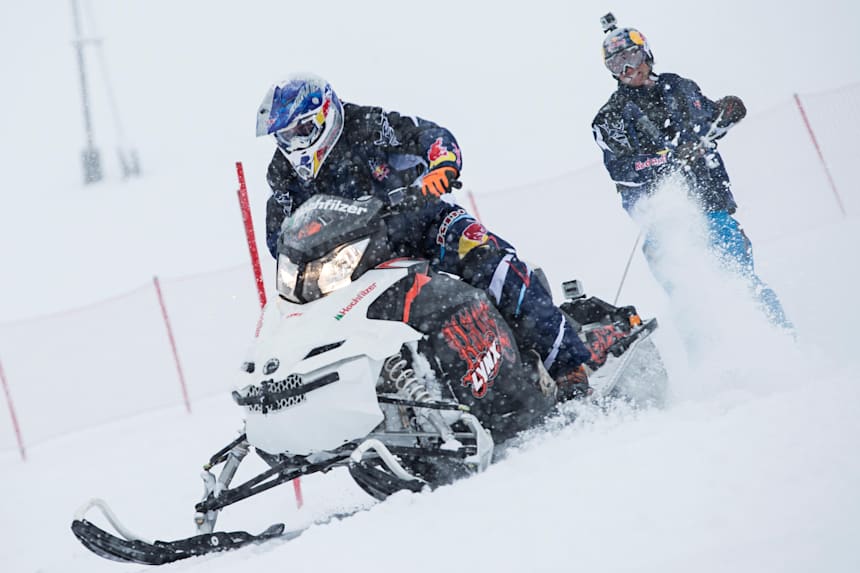 Skis Snowmobile Tow In Ski Racing At Arctic Man