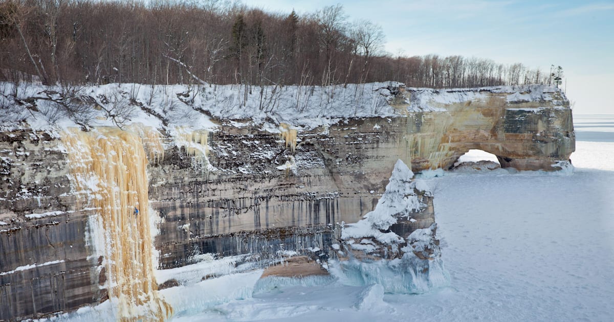 Winter ice climbing on the shores of Lake Michigan