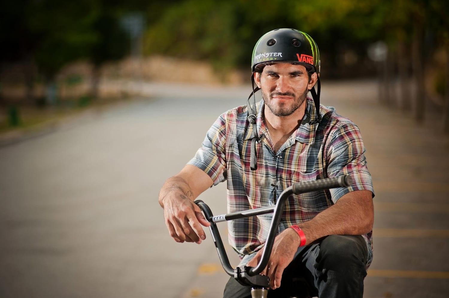 Dakota Roche Sitting on a Bike in the Street