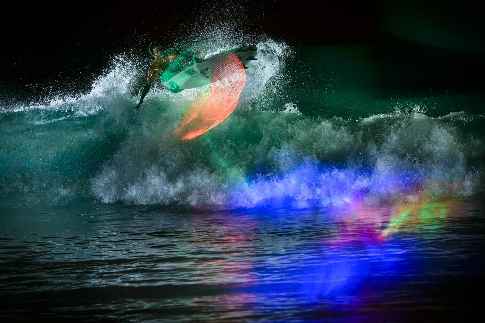 Big wave surfer Pedro Scooby from Brazil rides a wave during a tow surfing  session at Praia do Norte on the first big swell of winter season. (Photo  by Henrique Casinhas /