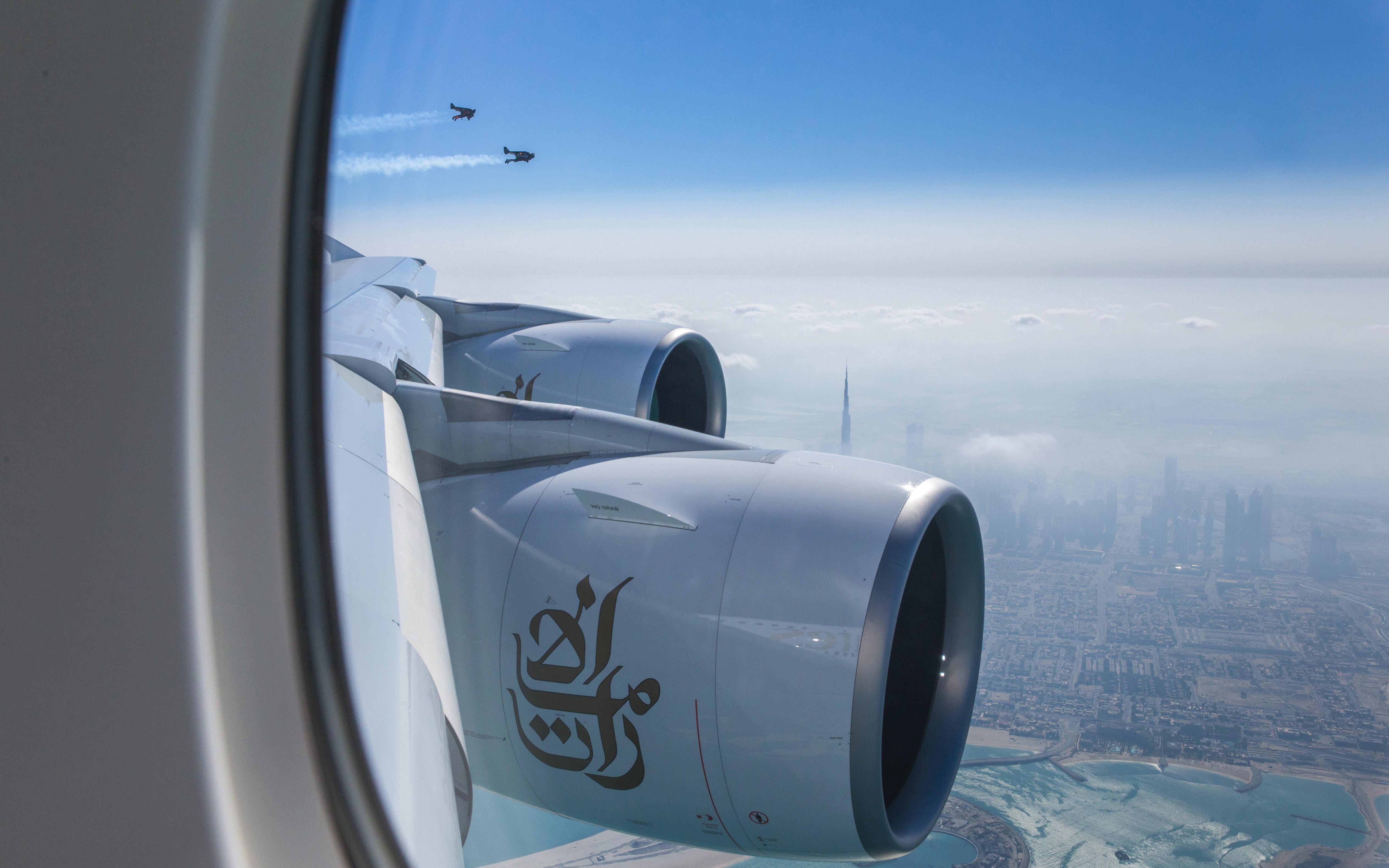 Watch Two Men in Jetpacks Fly Alongside a Jumbo Jet Over Dubai