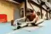 Clement Noël stretching in the gym.