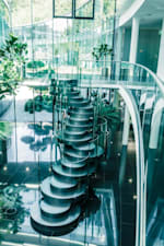 Interior design of the Red Bull base in Austria with many elements made of glass and with stairs in the form of round circles