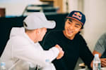 Two Red Bull interns shaking hands at the Red Bull headquarter in Fuschl am See near Salzburg
