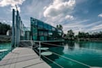 Glass building in the middle of the lake, where Red Bull employees can swim