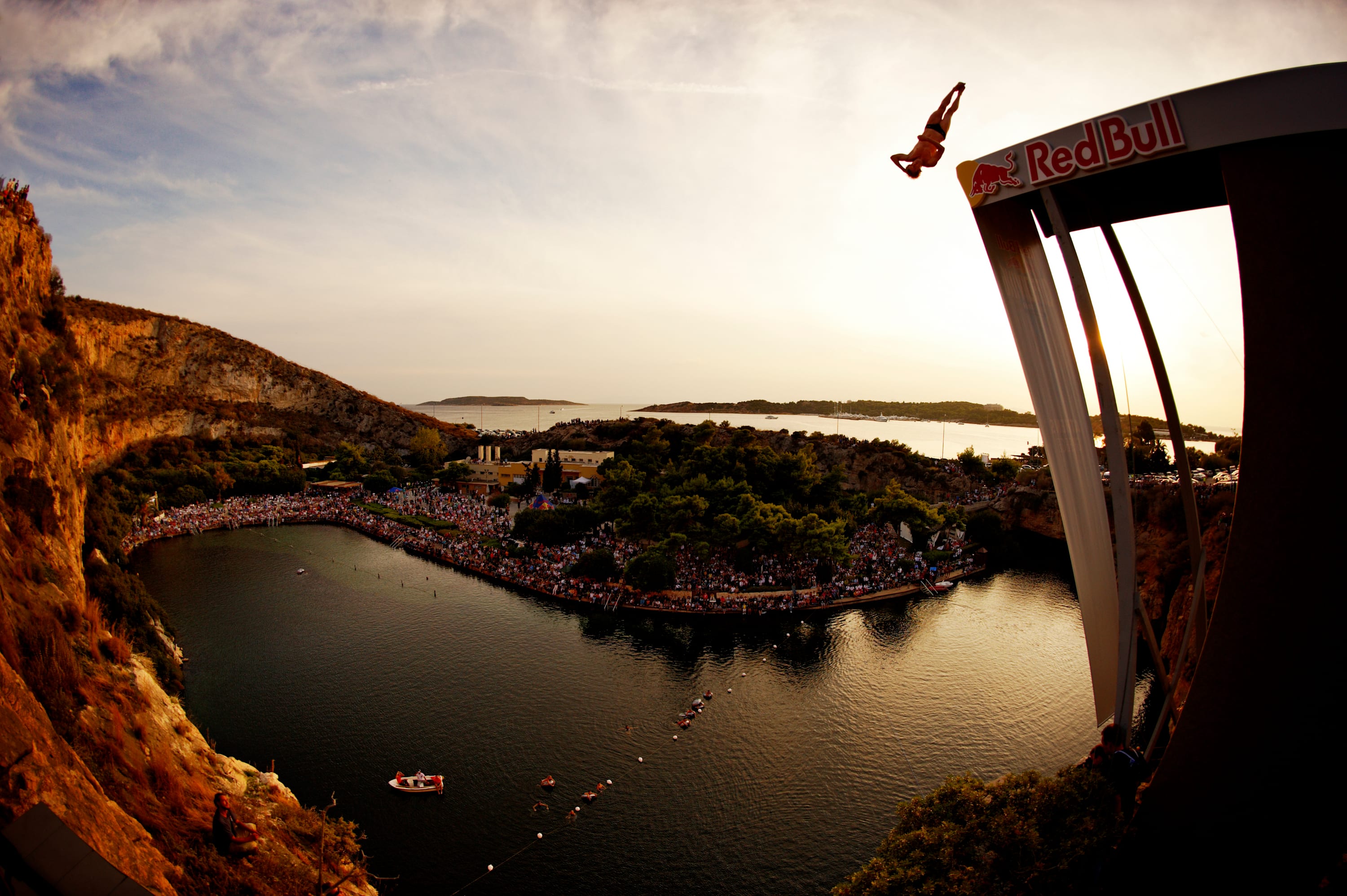 Gary Hunt's tornado-paced twists were captured at golden hour in Lake Vouliagmeni at the first-ever Greek stop on the Red Bull Cliff Diving calendar, 2009.
