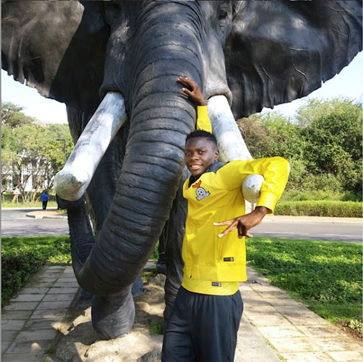 2015: Patson poses on a trip to South Africa to play with the national team